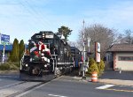 Chesapeake & Delaware GP38-2 # 2005 leads the Toys for Tots Train across Main Street 